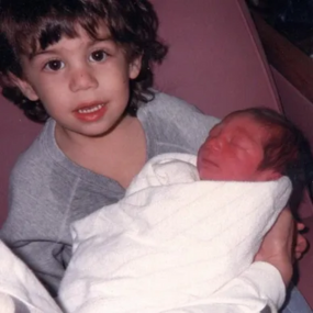 Ryan holding his cousin Jacob  February 1991